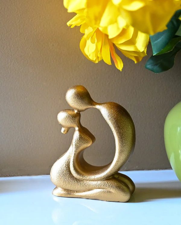 Elegant Golden Resin Romantic Abstract Kiss Figurine | 4 x 2 x 5 inches For Sale